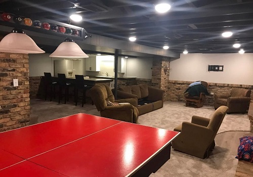 A recently completed rec room by Derrick Services after basement finishing in Peoria IL