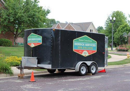 A Derrick Services trailer at the site of a home remodeling project