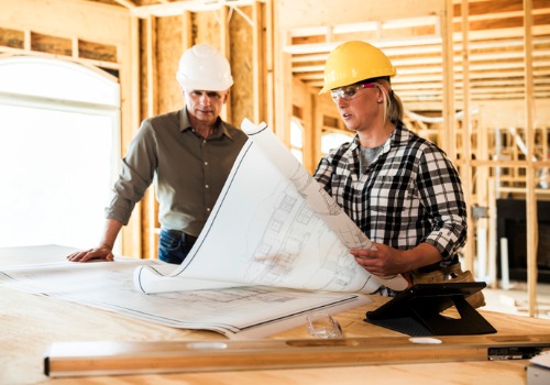 Two contractors review plans as they work on Home Remodeling in Washington IL